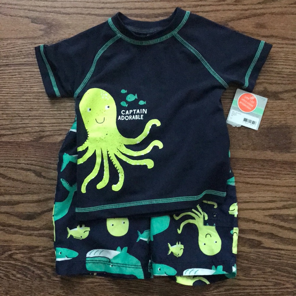 Carter’s swim shorts and rash guard